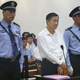 The Jinan Intermediate People's Court's website carries a photo of former Chinese Communist Party rising star Bo Xilai standing trial on charges of taking bribes, embezzlement and abuse of power at the court in Shandong Province on Aug. 22, 2013. (Kyodo via AP Images